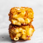Crispy Fried Homemade Mac and Cheese Bite cut in half and stacked on top of each other.