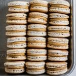 cardamom coffee macarons stacked on a tray