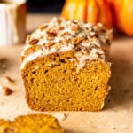 Slices of Maple Glazed Pumpkin Bread with chopped pecans on top