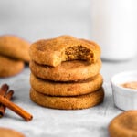 A stack of Brown Butter Bourbon Snickerdoodles with a bite missing from the top cookie