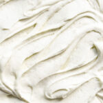 Close up of vanilla bean frosting swirls