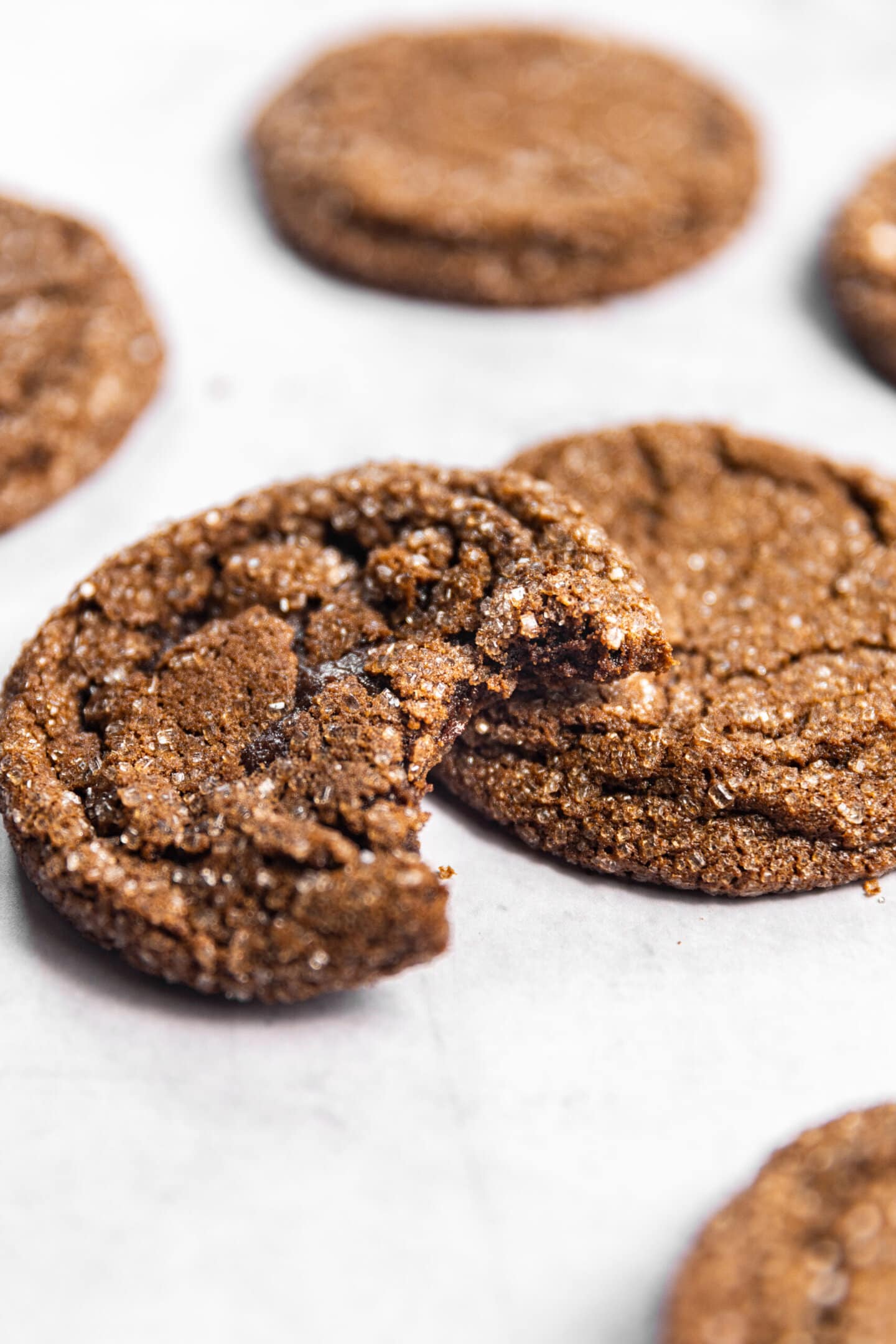 Close up of Drop-Style Chocolate Sugar Cookies with a bite missing from one