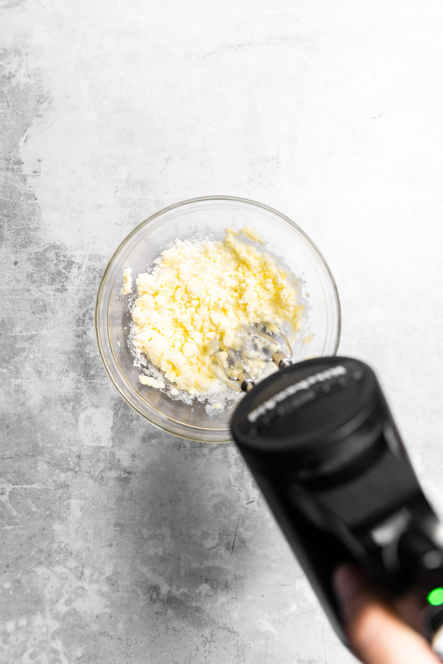 Butter and sugar being creamed together.
