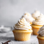 Small Batch Vanilla Cupcakes with vanilla bean buttercream and sprinkles on top.