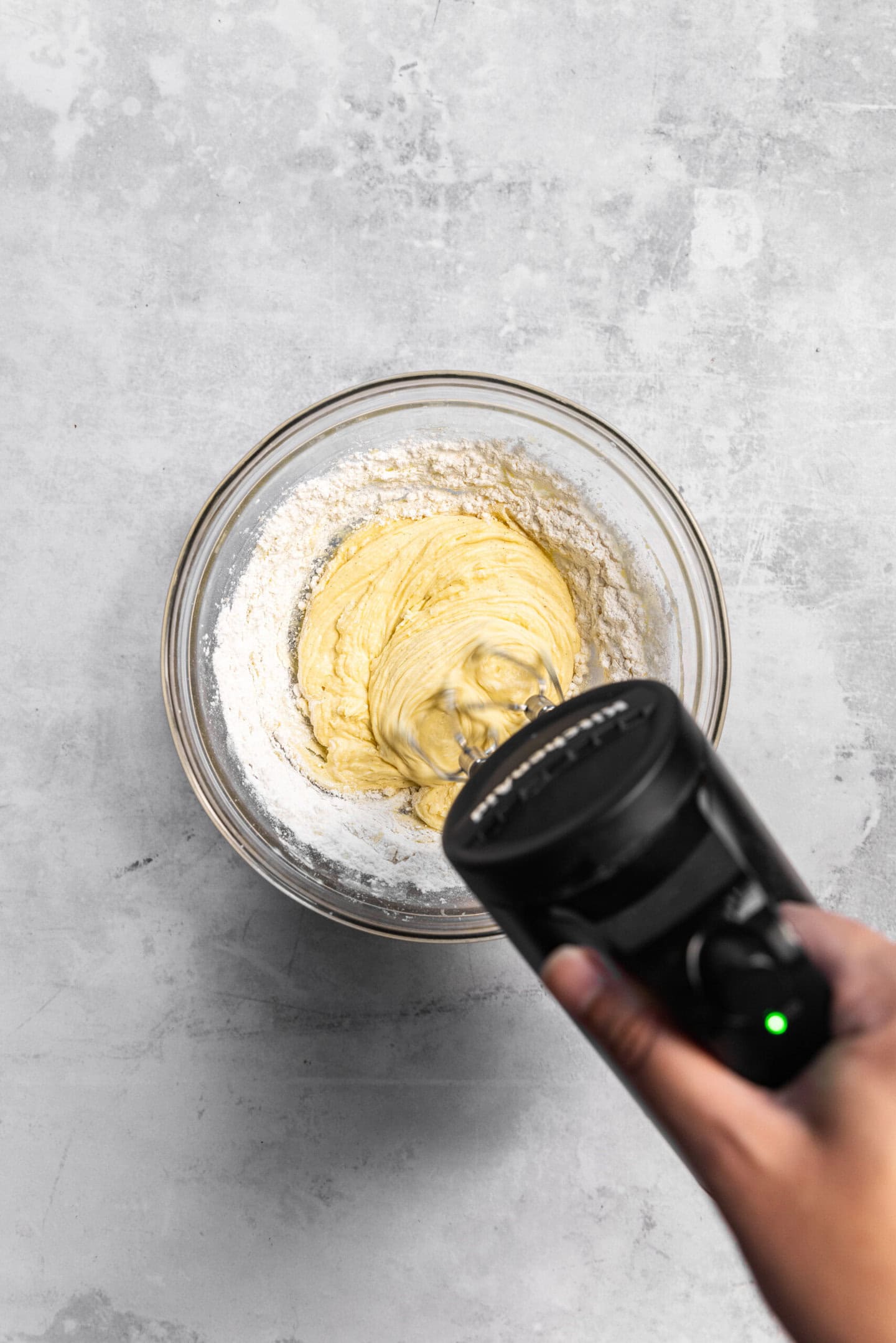 Dry ingredients being incorporated into cupcake batter