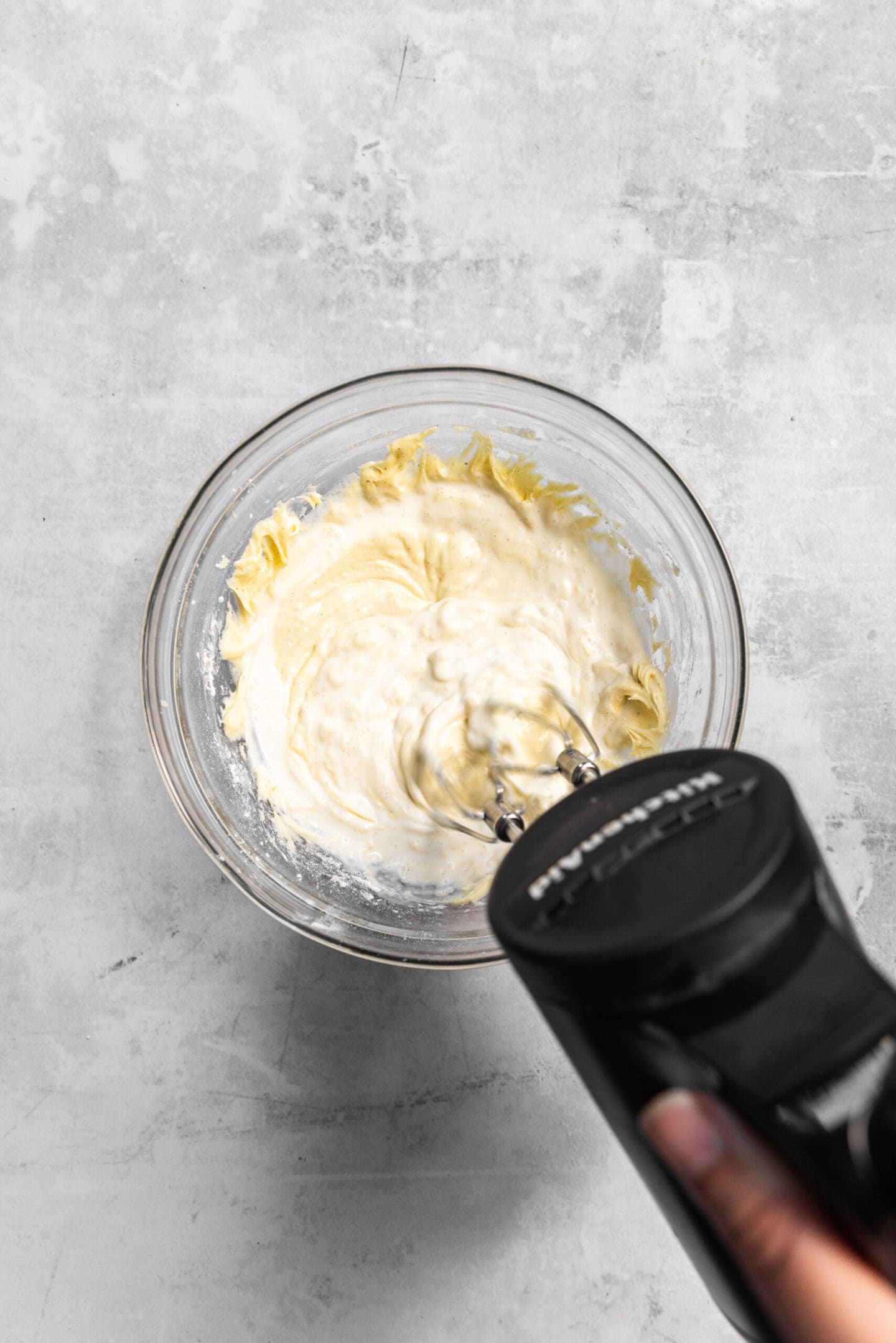 Heavy cream being beaten into cupcake batter