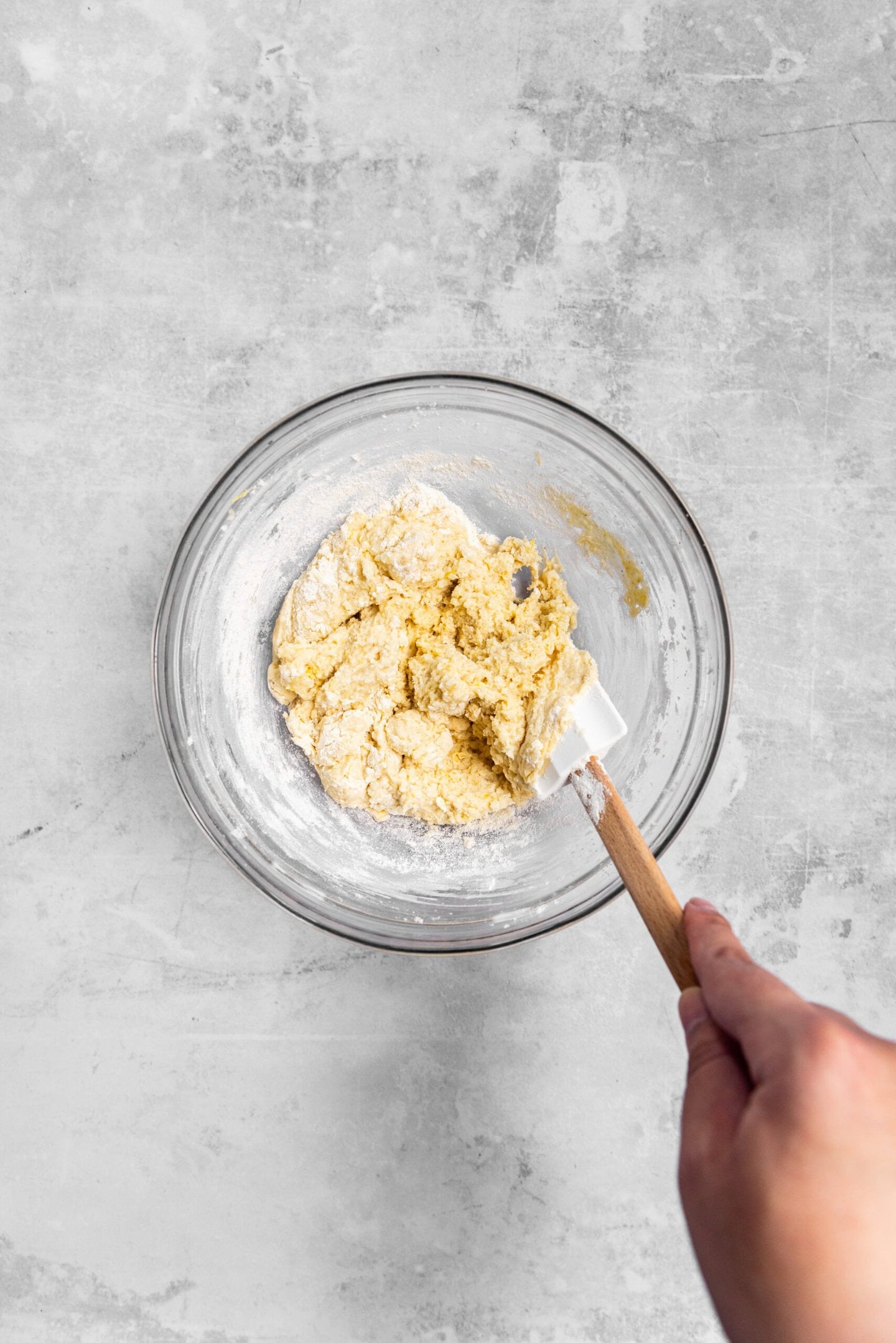 Dry ingredients being mixed in to form lemon sugar cookie dough