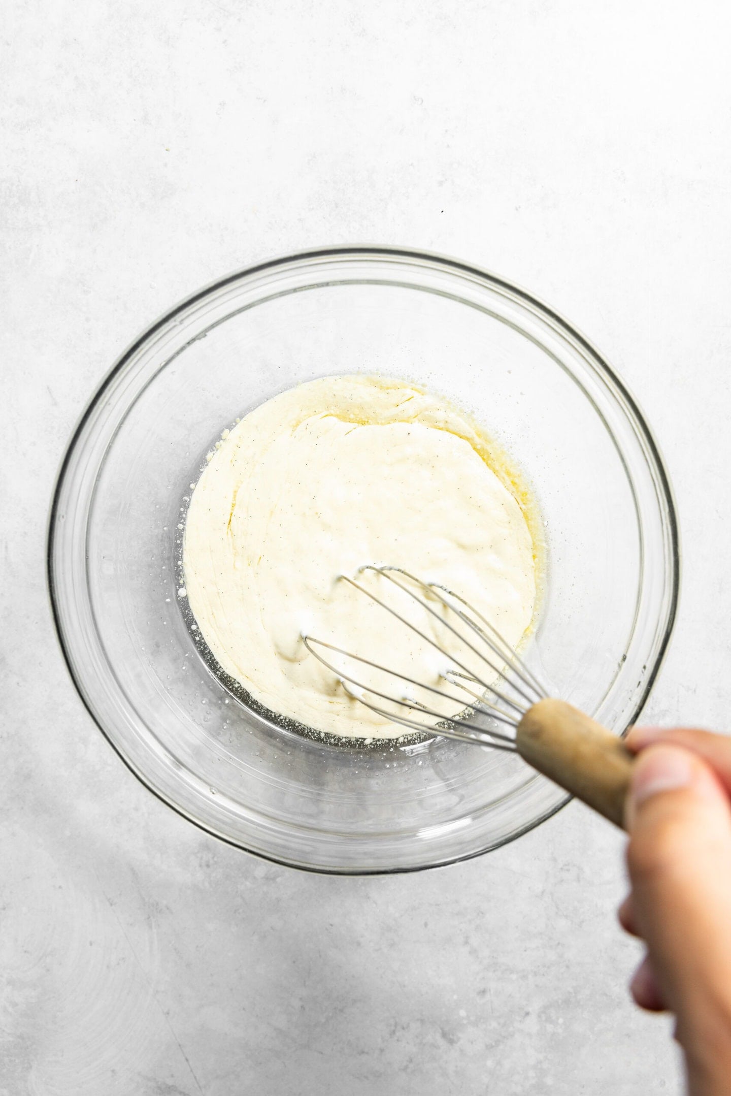 Wet ingredients being whisked together.