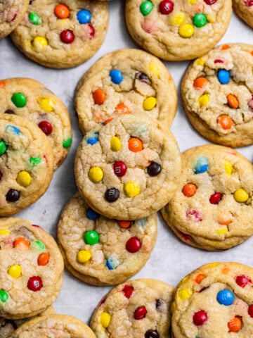 Close up of a tray of freshly baked soft M&M cookies.