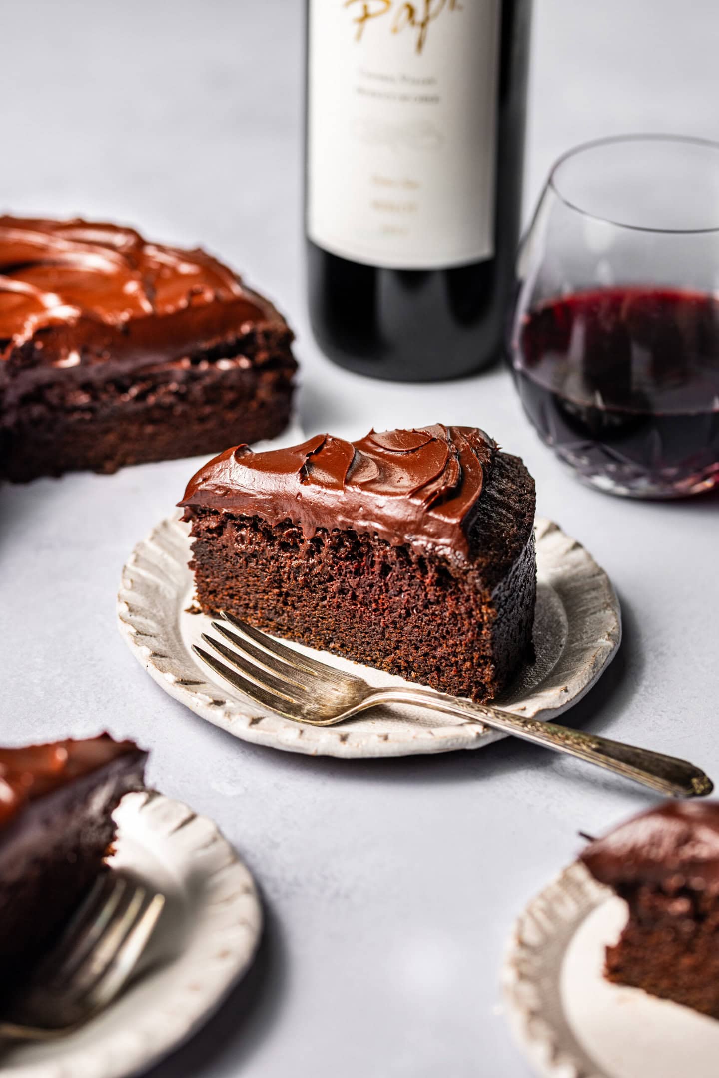 Close up of a slice of red wine chocolate cake showing off moist texture.